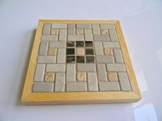 beige tile used as trivet, travertine look