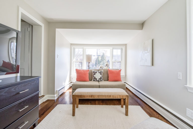 decluttered media cabinet in staged living room, better listing pics for home staging