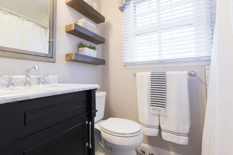 bathroom staging with faux plants and greenery