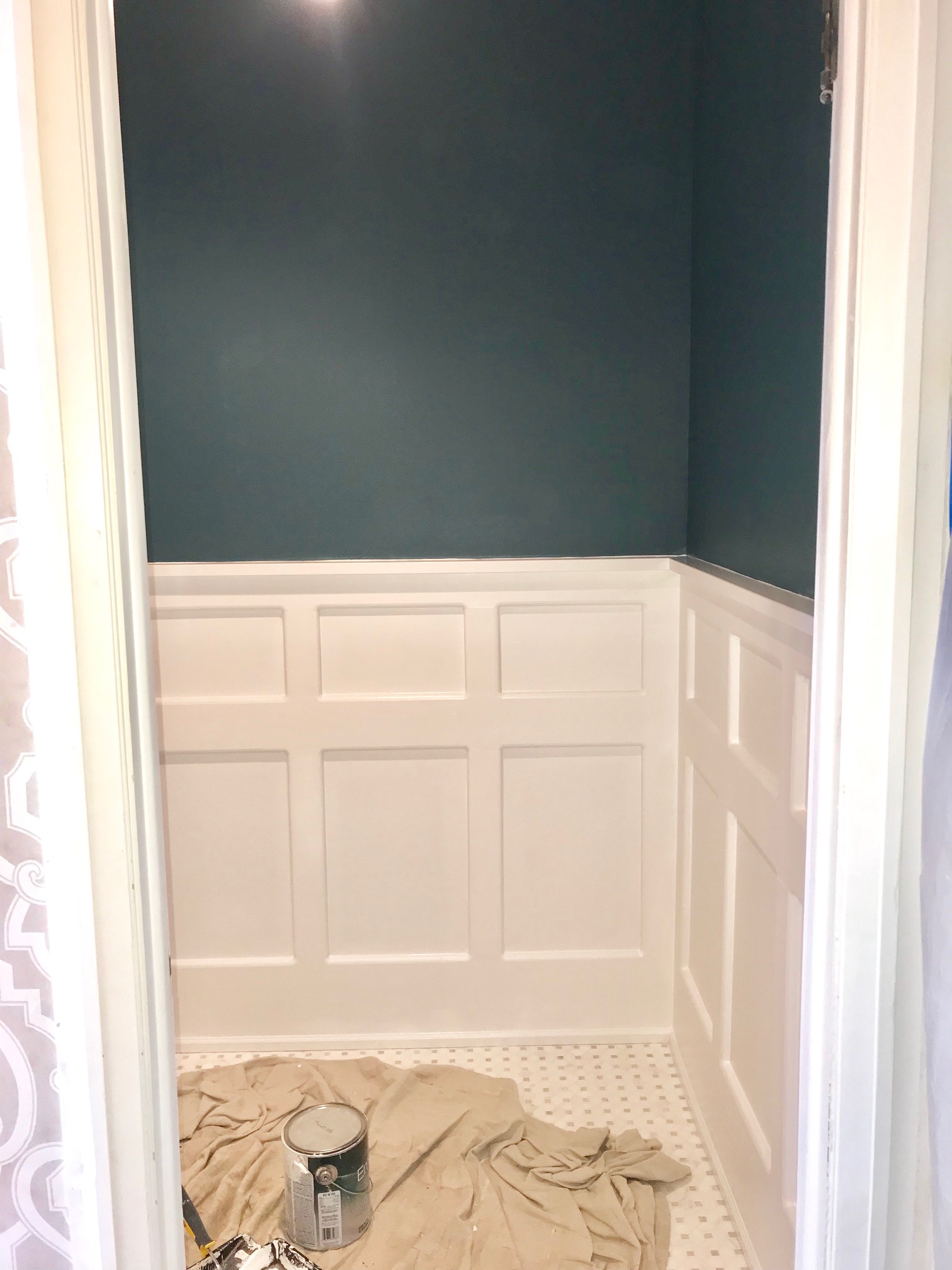 Bathroom makeover wainscot design by Lori Fischer of rethink home interiors