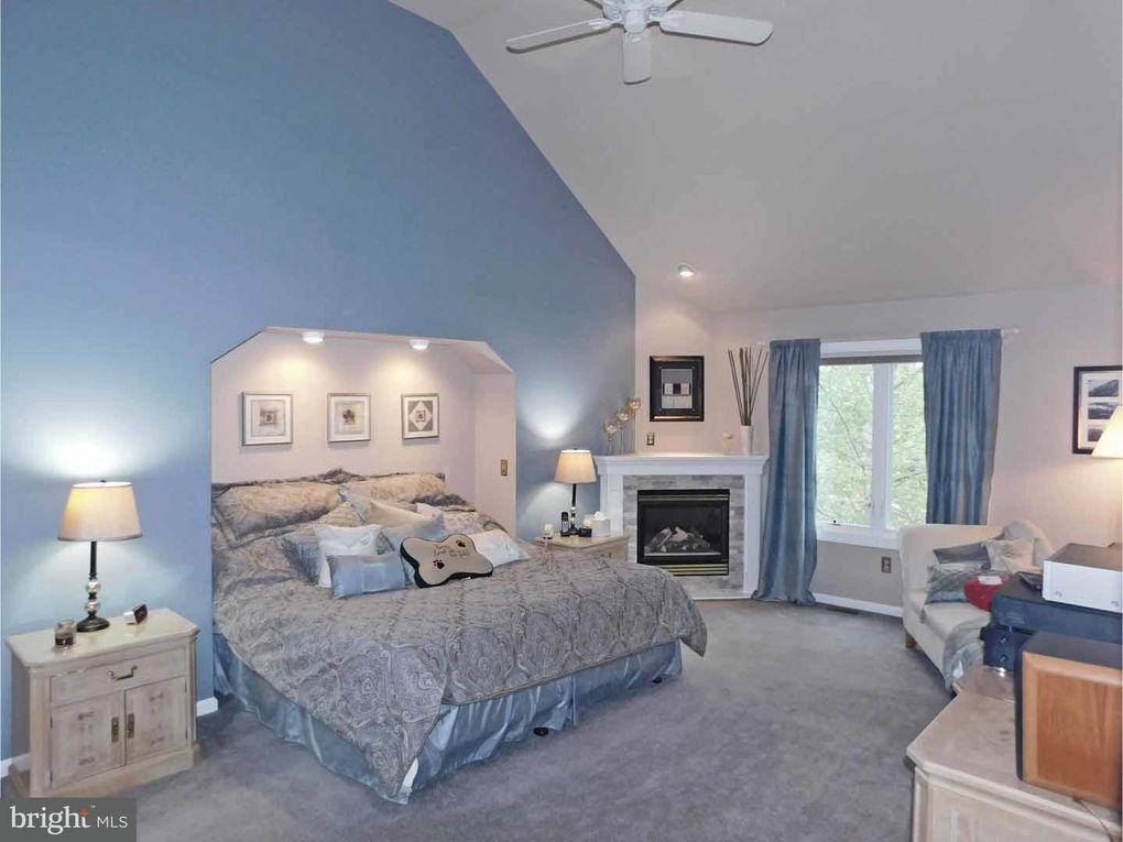 original listing photo of bedroom with blue painted walls