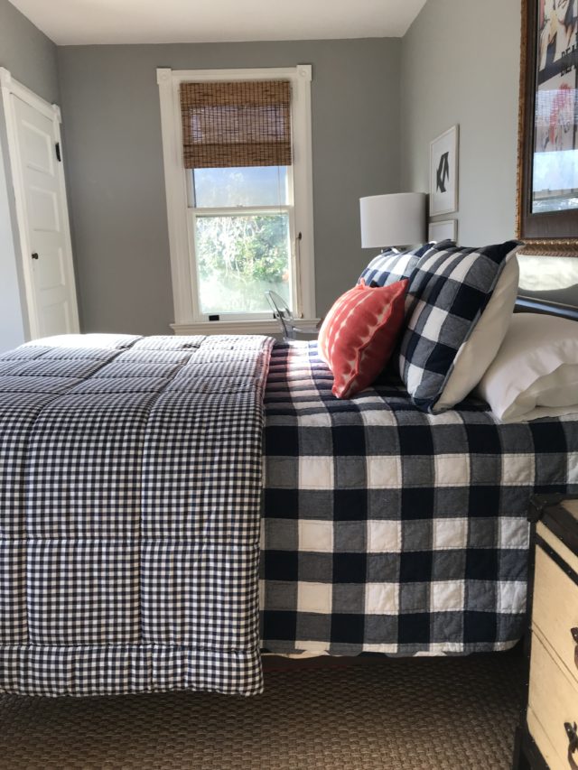 Bedroom with layers of plaid blankets on bed, How to make any bed perfectly