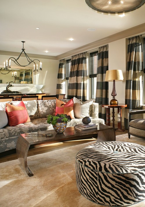 solid pillows on floral couches, striped drapes, update dated furniture