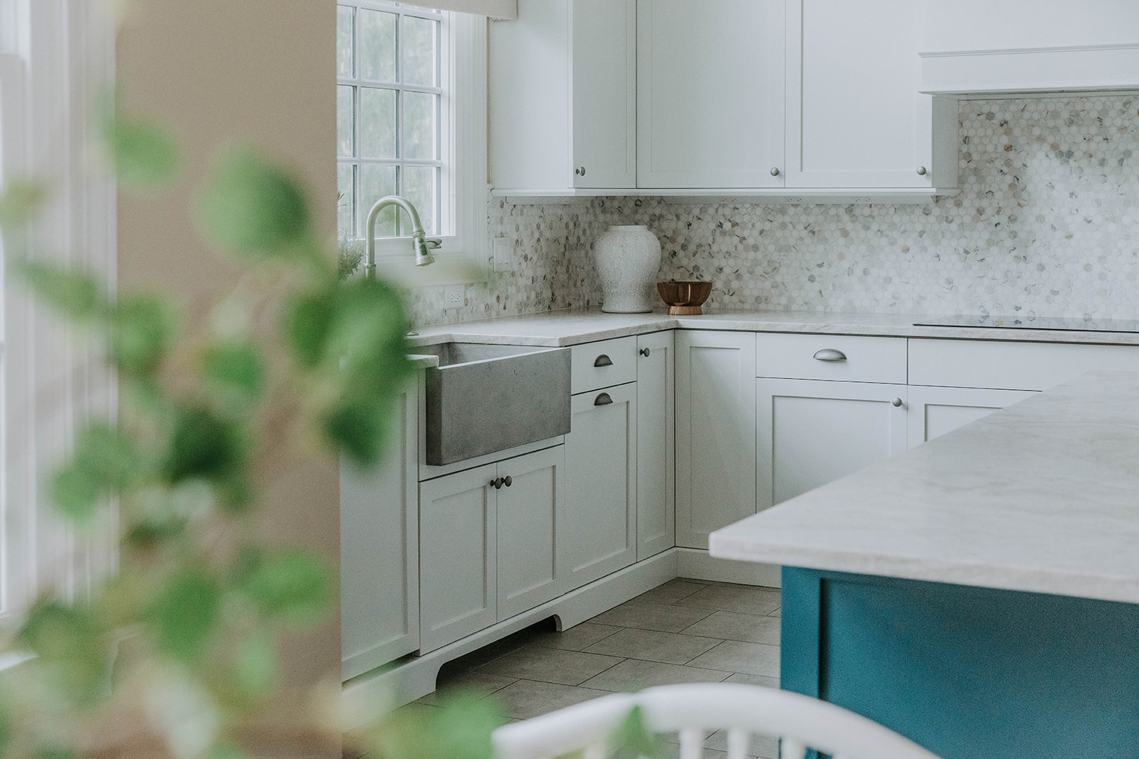 home staged white kitchen with plants on counter, market home staging business