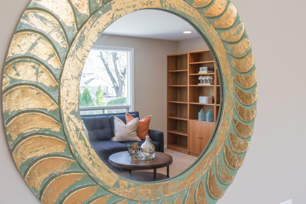 Mirror with home staged living room in reflection, new staging evaluation app